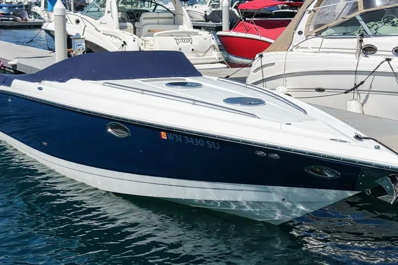  Yacht Photos Pics 2005 Cobalt 343 boat docked in marina, surrounded by other vessels.
