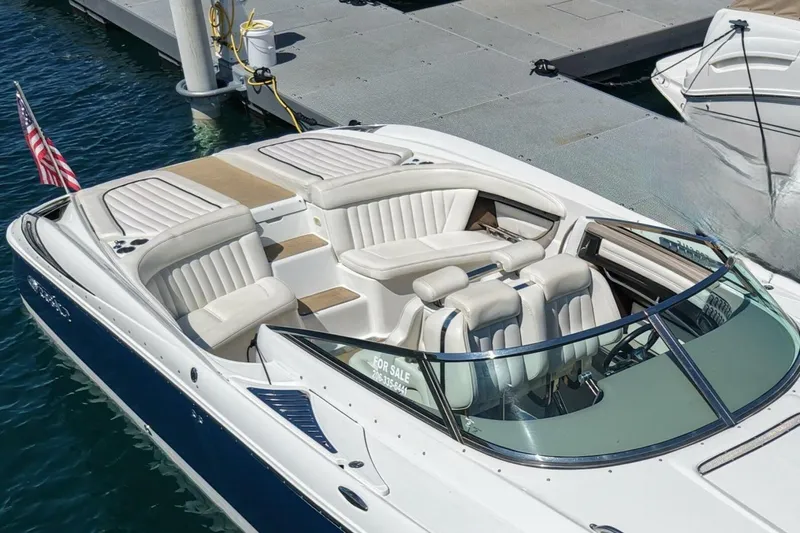  Yacht Photos Pics 2005 Cobalt 343 boat docked, featuring sleek design and luxurious seating.