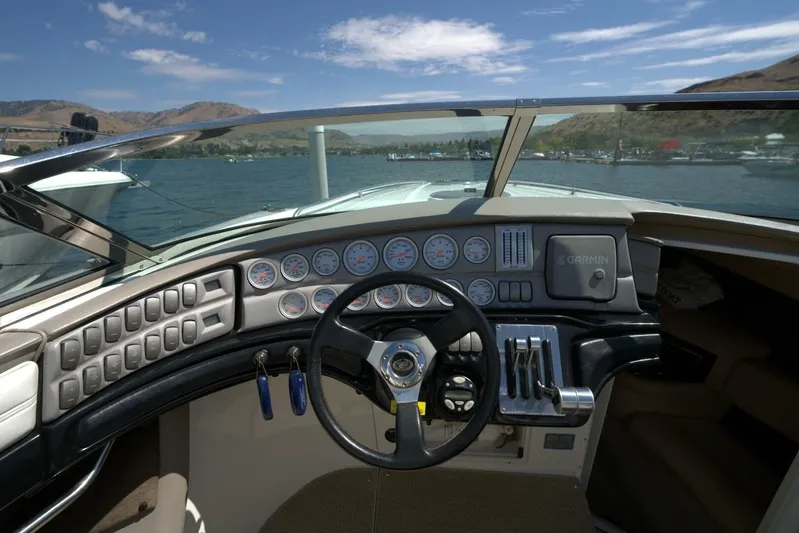  Yacht Photos Pics Cockpit view of a 2005 Cobalt 343 boat with gauges and steering wheel.