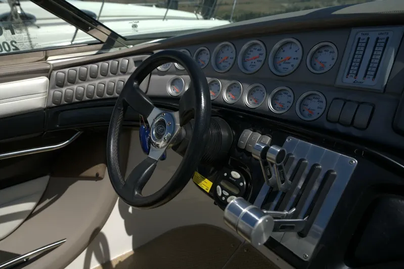  Yacht Photos Pics 2005 Cobalt 343 boat dashboard with steering wheel and control gauges.