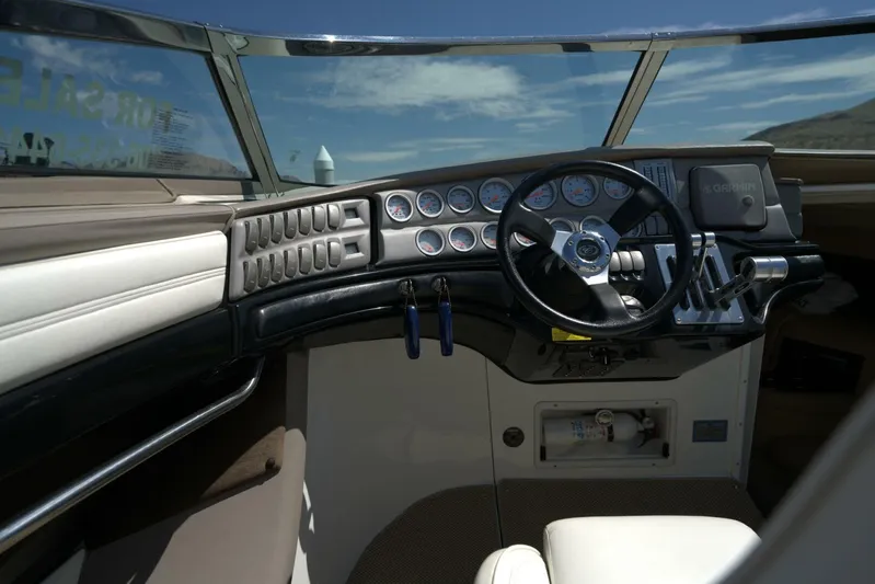  Yacht Photos Pics Interior of a 2005 Cobalt 343 boat showing steering wheel and dashboard controls.
