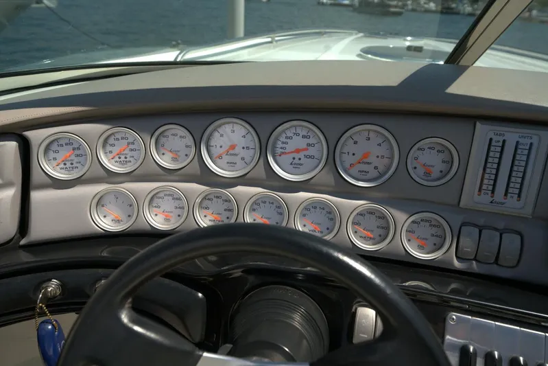  Yacht Photos Pics Dashboard of a 2005 Cobalt 343 boat with multiple gauges and controls.