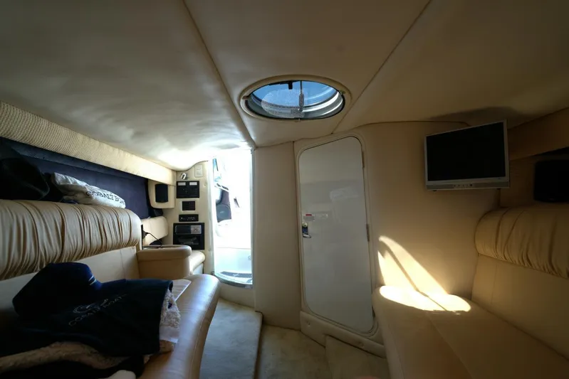  Yacht Photos Pics Luxurious interior of a 2005 Cobalt 343 boat with leather seating and a TV.