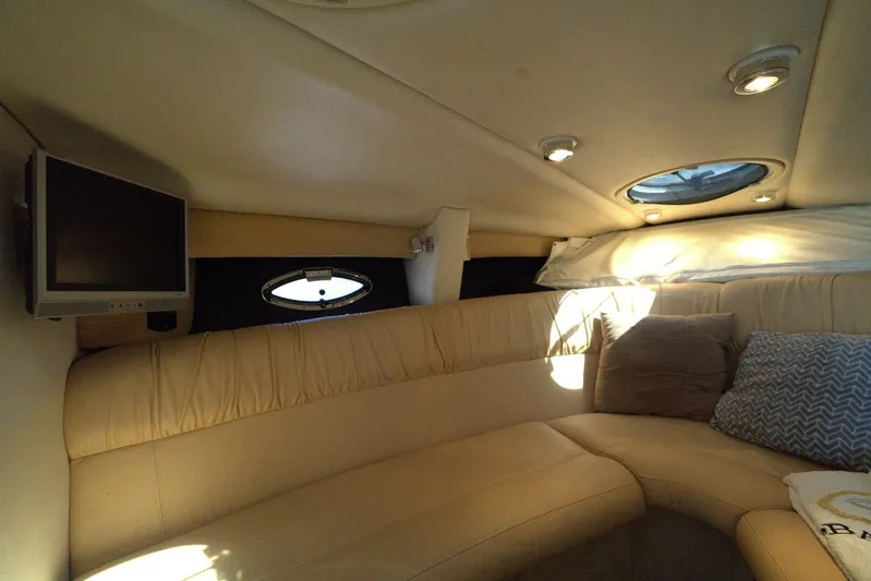  Yacht Photos Pics Interior of 2005 Cobalt 343 boat with cozy seating and small TV.