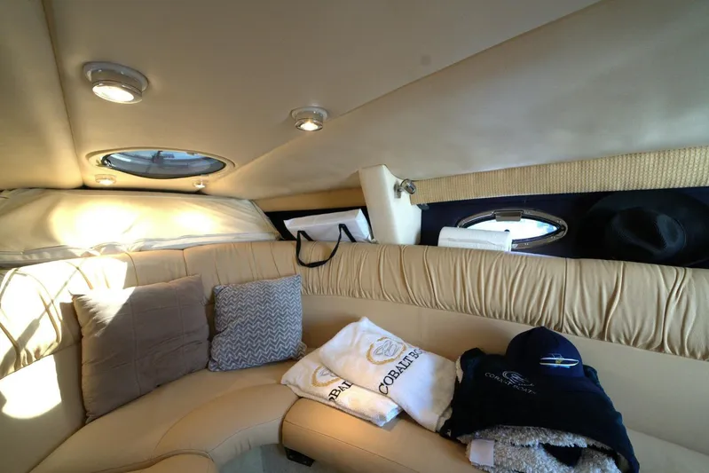  Yacht Photos Pics Luxurious interior of a 2005 Cobalt 343 boat with plush seating and accessories.