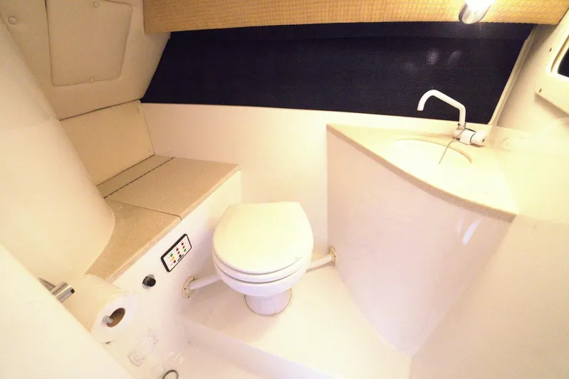  Yacht Photos Pics 2005 Cobalt 343 boat bathroom with toilet, sink, and storage.