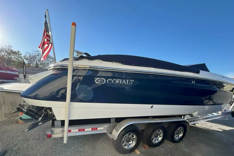  Yacht Photos Pics 2005 Cobalt 343 boat on trailer with American flag in background.