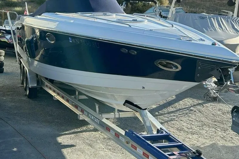  Yacht Photos Pics 2005 Cobalt 343 boat on trailer, parked outdoors, side view.