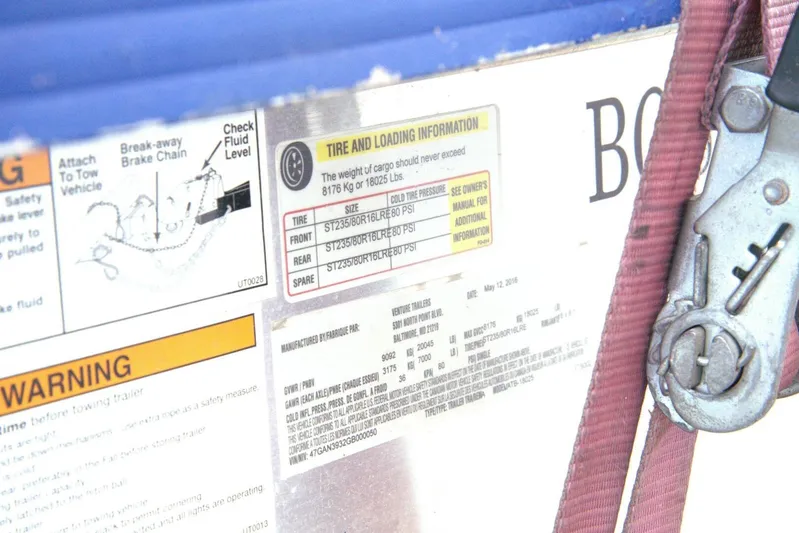  Yacht Photos Pics 2005 Cobalt 343 tire and loading information label with safety warnings and brake chain diagram.