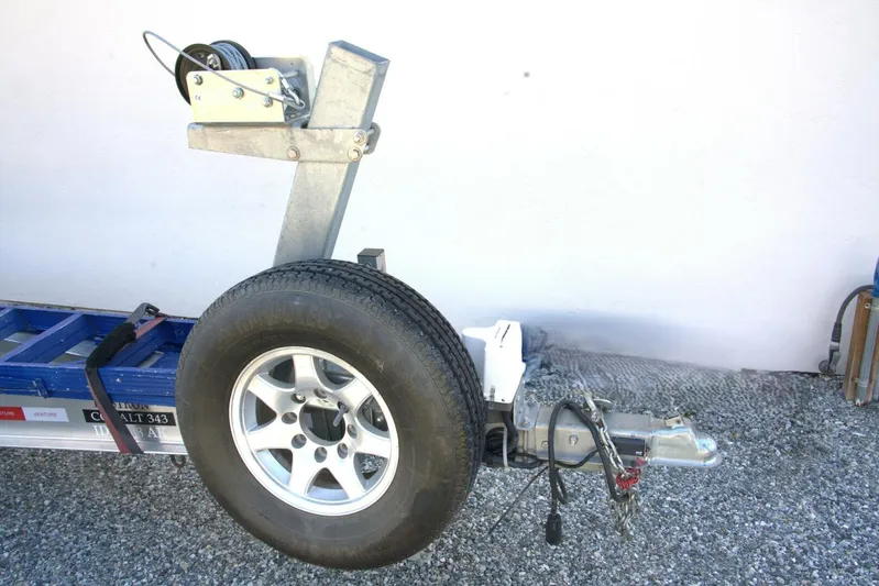  Yacht Photos Pics Trailer hitch with spare tire and winch on a 2005 Cobalt 343.