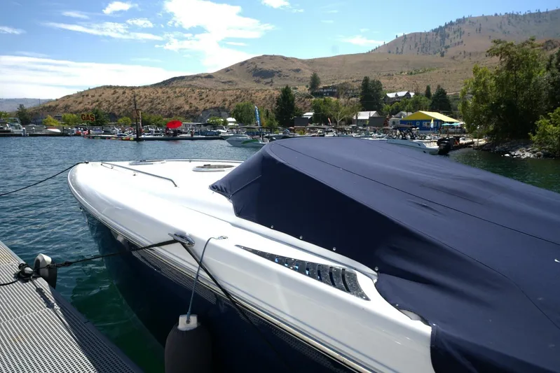  Yacht Photos Pics 2005 Cobalt 343 boat docked at a scenic marina with hills in the background.