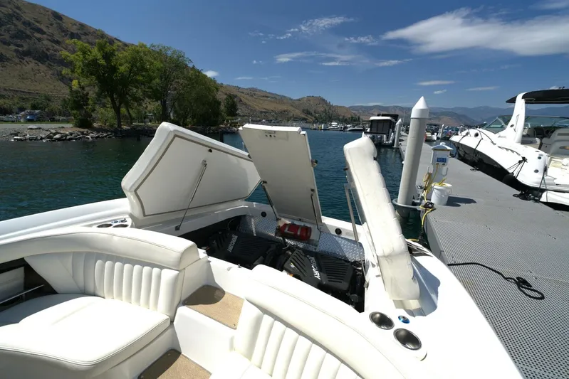  Yacht Photos Pics 2005 Cobalt 343 boat docked, open engine compartment, scenic lake and mountain backdrop.