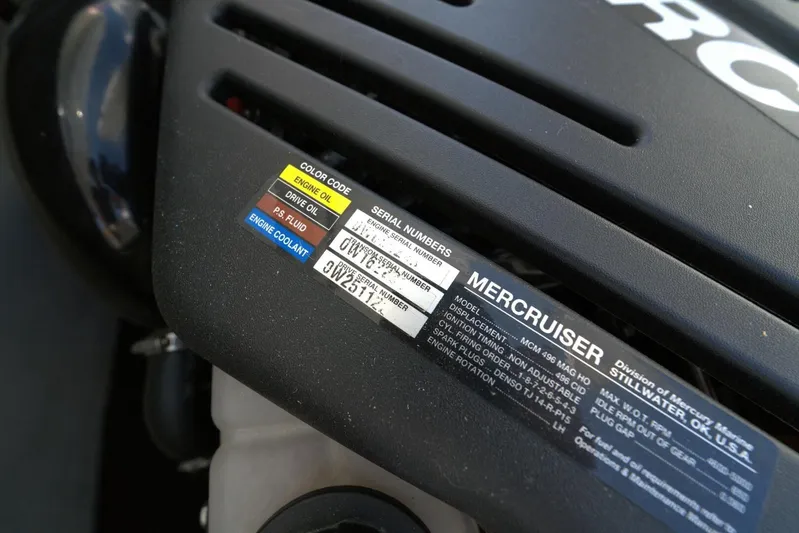  Yacht Photos Pics Engine cover of a 2005 Cobalt 343 with MerCruiser label and color-coded fluid indicators.