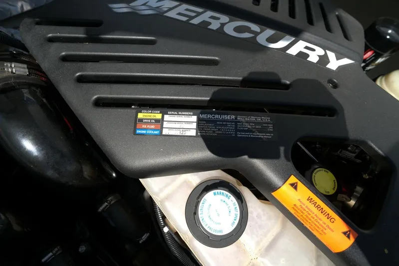  Yacht Photos Pics Engine cover of a 2005 Cobalt 343 with Mercury branding and warning labels.
