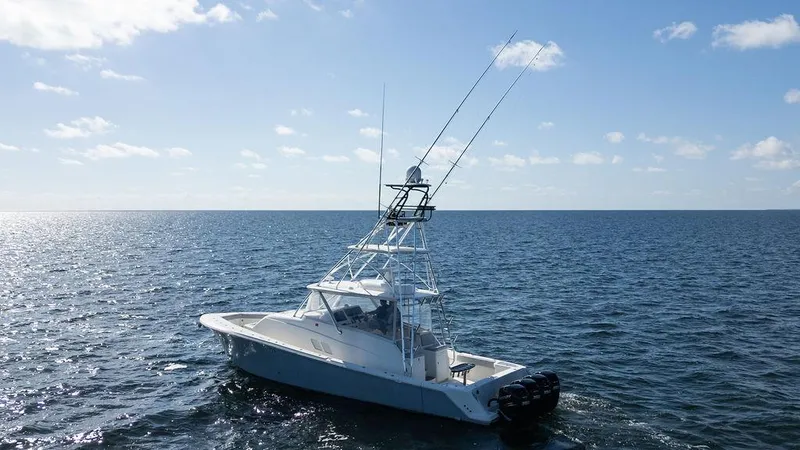  Yacht Photos Pics 2015 SeaVee 430 Fisharound boat cruising on open ocean under clear sky.