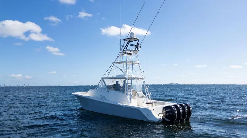  Yacht Photos Pics 2015 SeaVee 430 Fisharound boat on open water under clear blue sky.