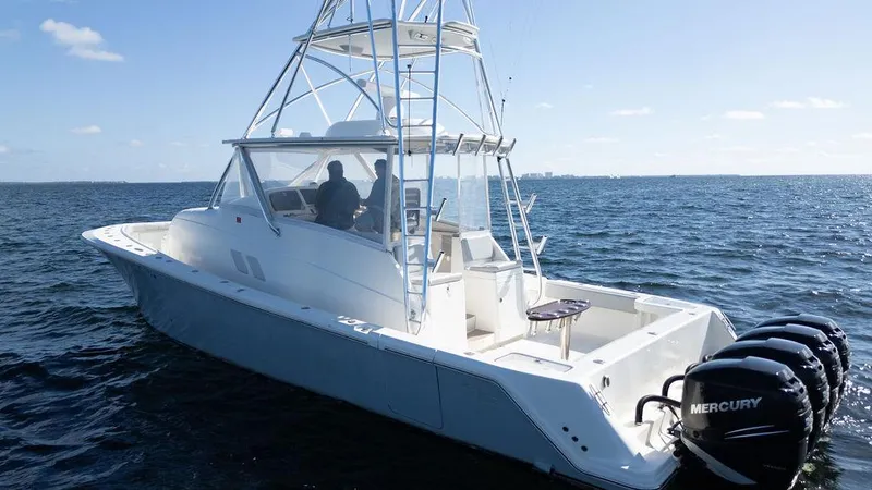  Yacht Photos Pics 2015 SeaVee 430 Fisharound boat on open water with Mercury engines.