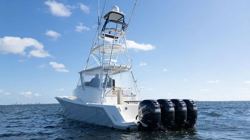  Yacht Photos Pics 2015 SeaVee 430 Fisharound boat with four powerful outboard engines on open water.