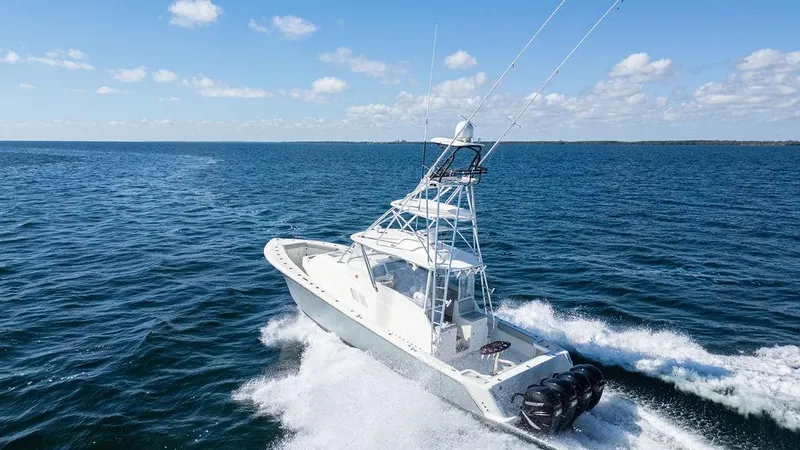  Yacht Photos Pics 2015 SeaVee 430 Fisharound cruising on open ocean under clear skies.