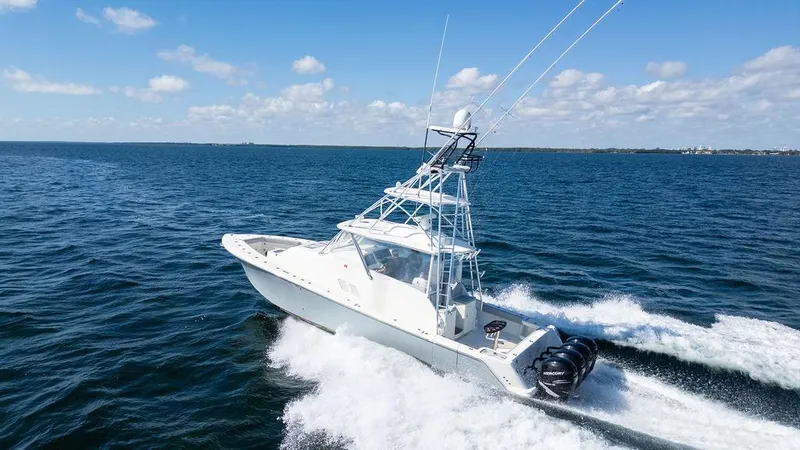  Yacht Photos Pics 2015 SeaVee 430 Fisharound boat cruising on open water, clear sky background.