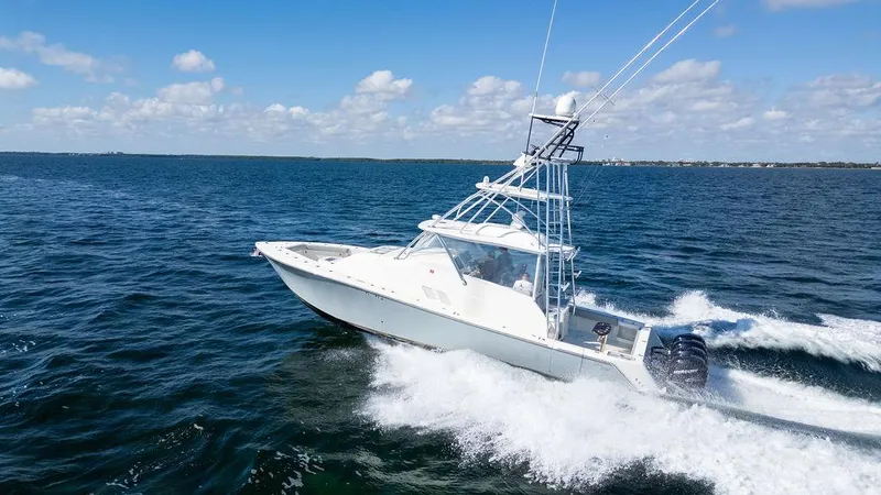  Yacht Photos Pics 2015 SeaVee 430 Fisharound cruising on open water under a clear blue sky.