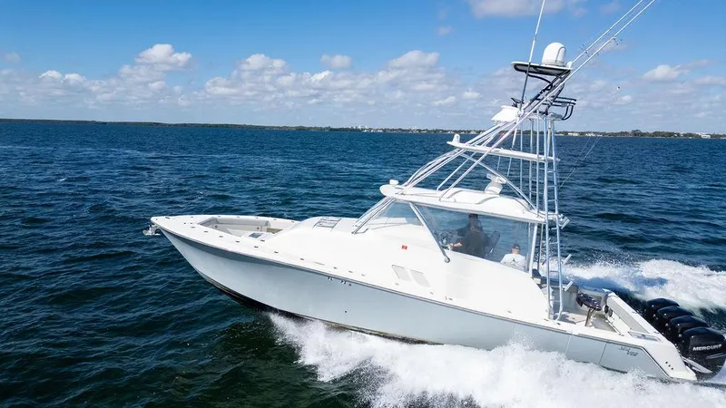  Yacht Photos Pics 2015 SeaVee 430 Fisharound boat cruising on open water under a clear sky.