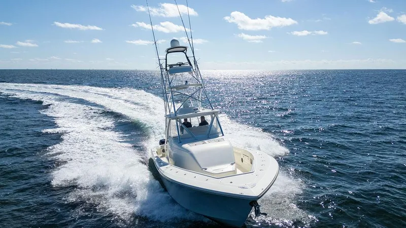  Yacht Photos Pics 2015 SeaVee 430 Fisharound cruising on open ocean under clear blue sky.