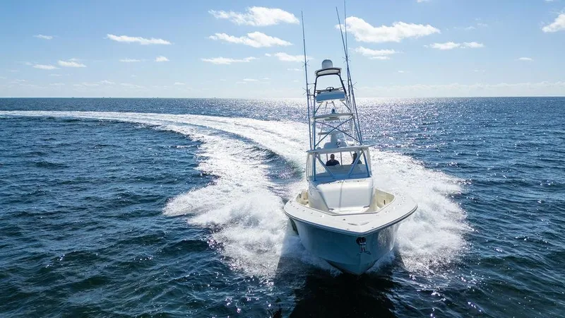  Yacht Photos Pics 2015 SeaVee 430 Fisharound cruising on open ocean under clear blue sky.
