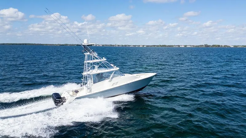  Yacht Photos Pics 2015 SeaVee 430 Fisharound cruising on open water under a clear blue sky.