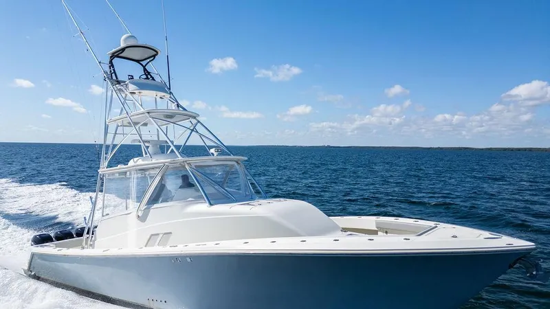  Yacht Photos Pics 2015 SeaVee 430 Fisharound cruising on open water under clear skies.
