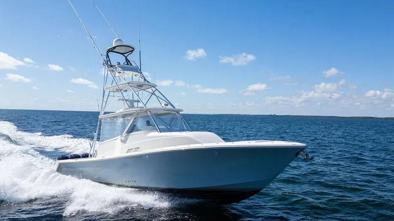  Yacht Photos Pics 2015 SeaVee 430 Fisharound cruising on open water under clear skies.