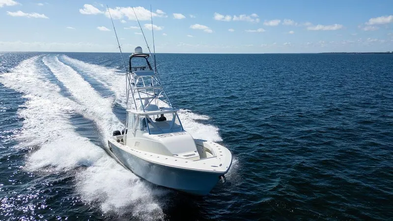  Yacht Photos Pics 2015 SeaVee 430 Fisharound cruising on open water under clear skies.