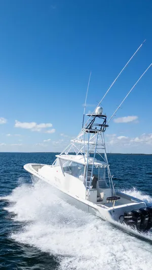  Yacht Photos Pics 2015 SeaVee 430 Fisharound cruising on open water under clear blue skies.