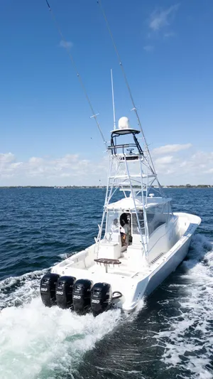  Yacht Photos Pics 2015 SeaVee 430 Fisharound boat cruising on open water with four engines.