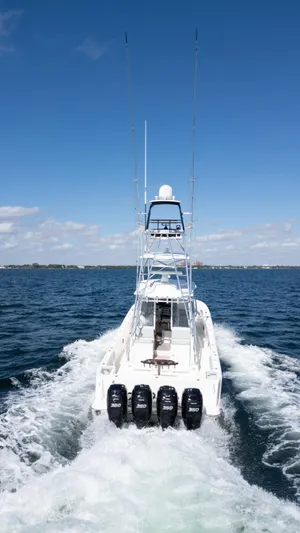  Yacht Photos Pics 2015 SeaVee 430 Fisharound boat cruising on open water with four engines.