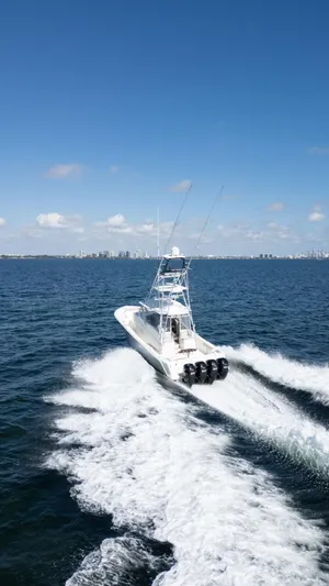  Yacht Photos Pics 2015 SeaVee 430 Fisharound cruising on open water under clear blue skies.