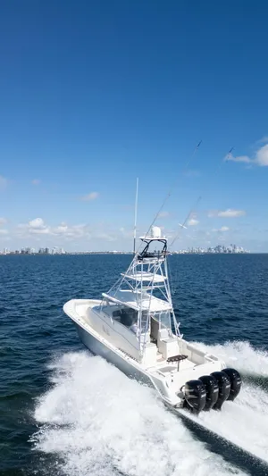  Yacht Photos Pics 2015 SeaVee 430 Fisharound cruising on open water under clear blue skies.