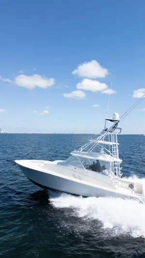  Yacht Photos Pics 2015 SeaVee 430 Fisharound cruising on open water under a clear blue sky.