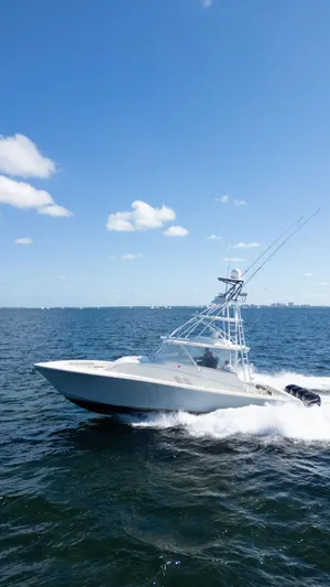  Yacht Photos Pics 2015 SeaVee 430 Fisharound cruising on open water under a clear blue sky.