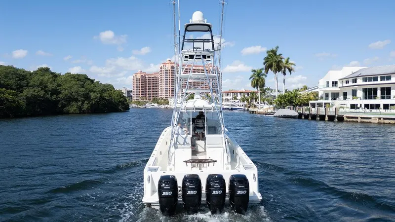  Yacht Photos Pics 2015 SeaVee 430 Fisharound boat with four engines cruising on a sunny waterway.