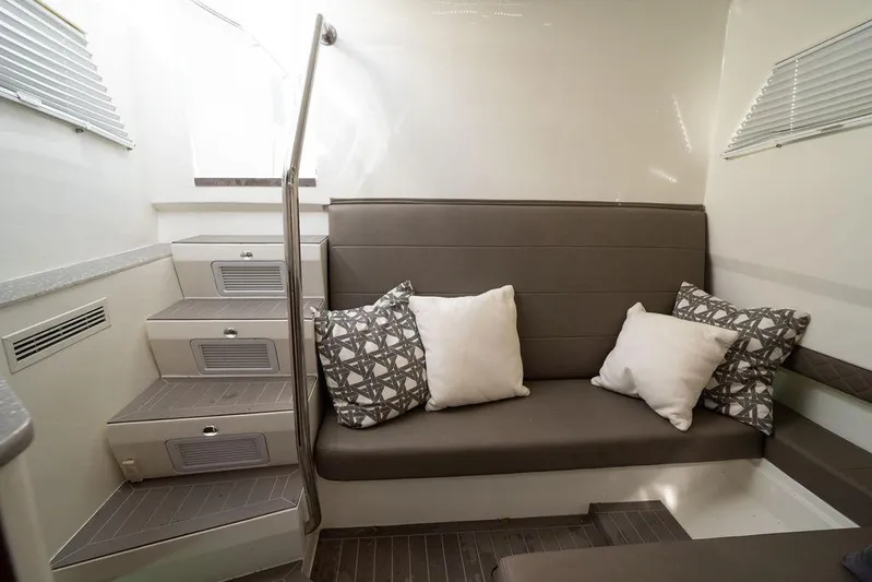  Yacht Photos Pics Interior of 2015 SeaVee 430 Fisharound with cushioned seating and decorative pillows.