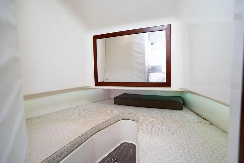  Yacht Photos Pics 2015 SeaVee 430 Fisharound cabin interior with bed and mirror.