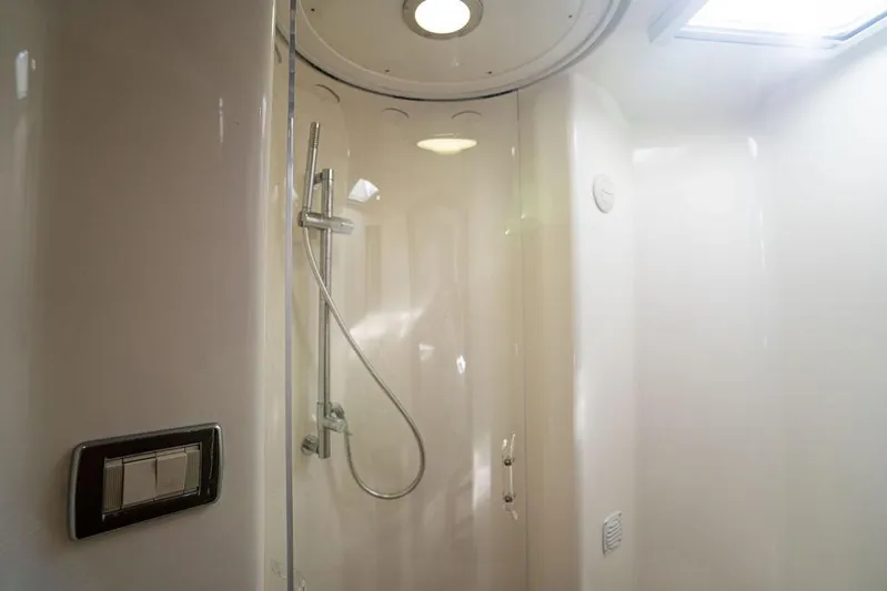  Yacht Photos Pics 2015 SeaVee 430 Fisharound shower interior with modern fixtures and lighting.