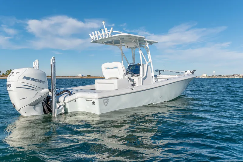  Yacht Photos Pics 2020 BARKER 26 boat on water with Mercury engine, clear sky background.