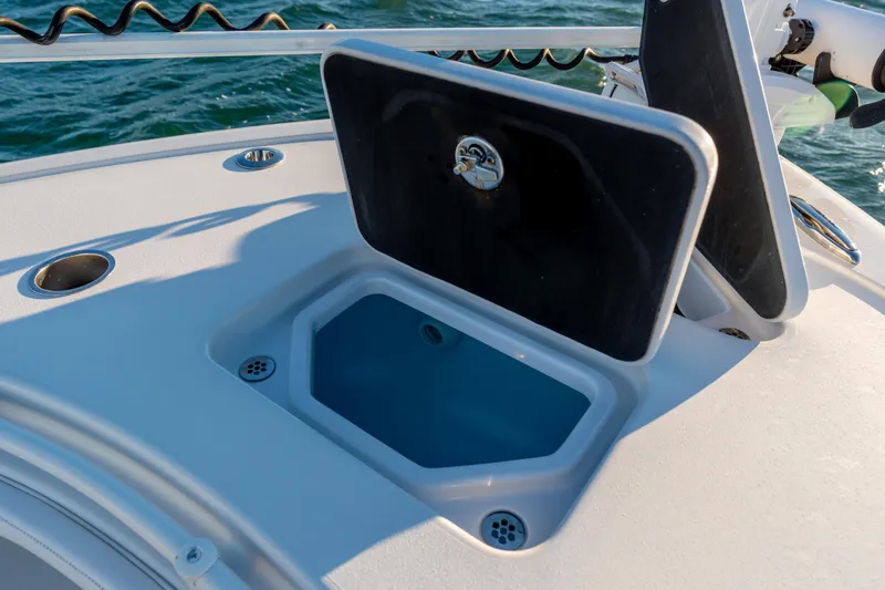  Yacht Photos Pics Open storage compartment on 2020 BARKER 26 boat, with ocean background.