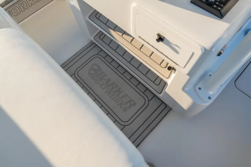  Yacht Photos Pics BARKER 26 boat interior, featuring storage compartment and branded mat, 2020 model.