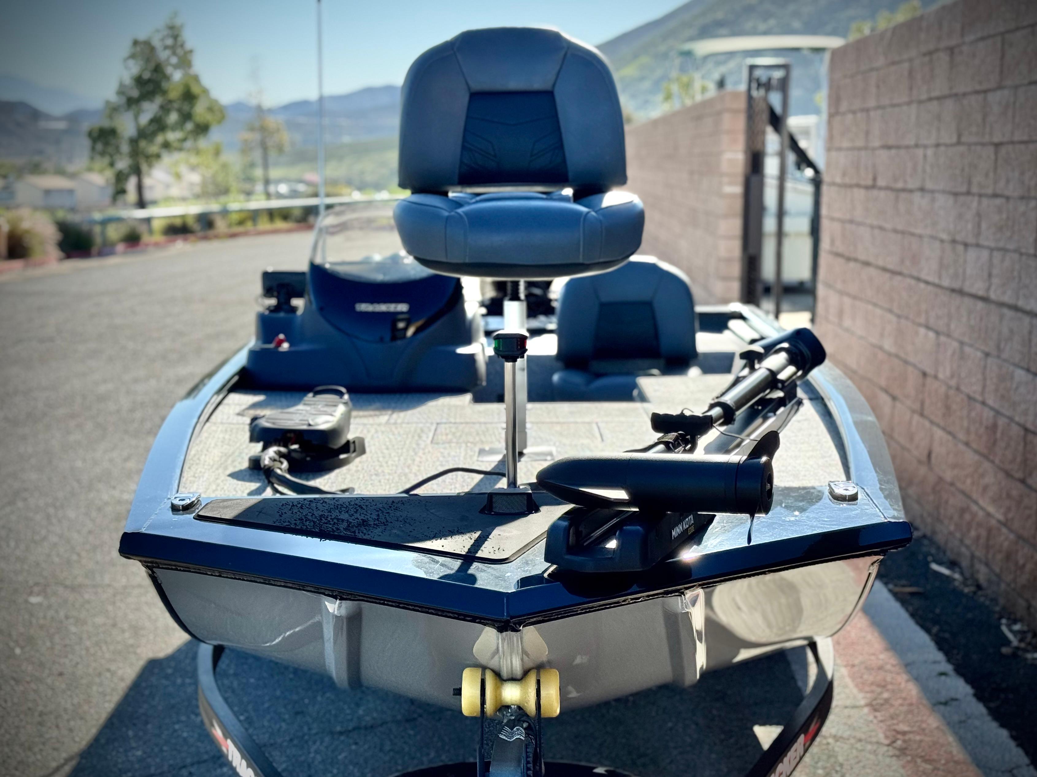 2024 Tracker Pro 170 boat with seating and equipment, parked outdoors.