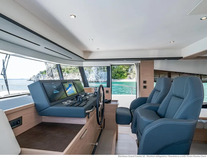  Yacht Photos Pics Interior of 2025 Beneteau Grand Trawler 62, featuring modern helm and ocean view.