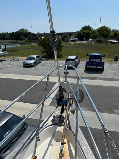 Pacific Seacraft Crealock 37 Yacht Photos Pics Pacific Seacraft Crealock 37 sailboat bow, 1995 model, parked near a road and grassy area.