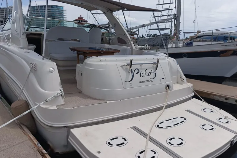 2000 Sea Ray 460 Sundancer @ Ixtapa Yacht Photos Pics 2000 Sea Ray 460 Sundancer docked, featuring spacious deck and seating area.